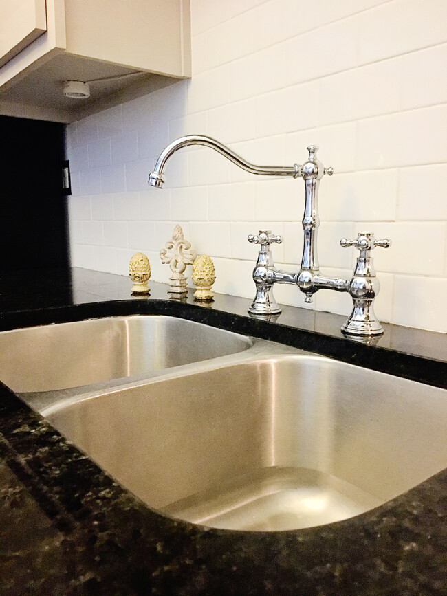 Gooseneck faucet, garbage disposal, granite countertops. - 659 Auburn Ave NE #145