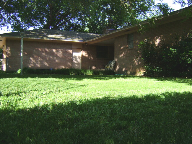 Big back yard; great for cookouts or a place for the dogs to run around. - 8060 Woodhue Rd