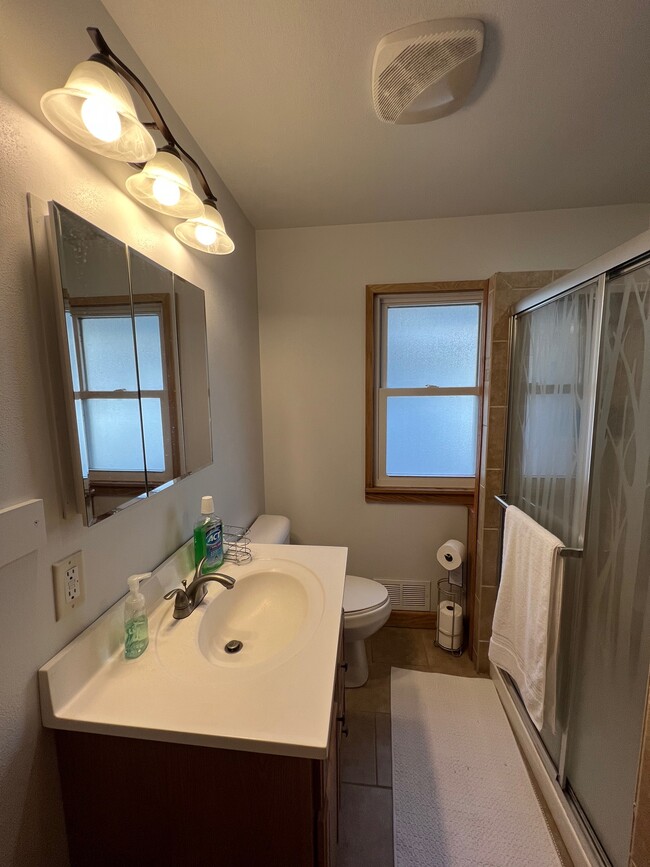 Main floor bathroom with shower. - 1060 21st Ave SE