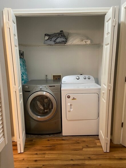 Washer and dryer closet with storage shelf - 1523 Telfair Way