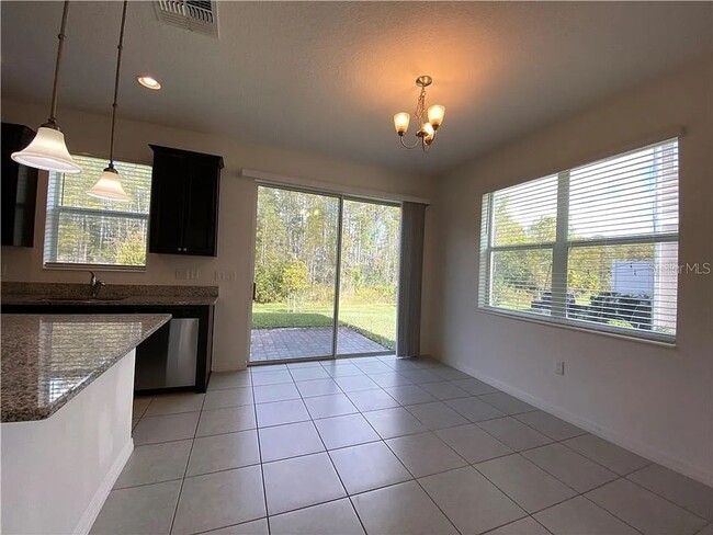 Building Photo - Beautiful End Unit Townhome Near Lake Nona w/ 2-Car Garage & Conservation Views!