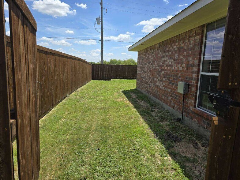 From fence gate looking in - 1185 Greywood Dr