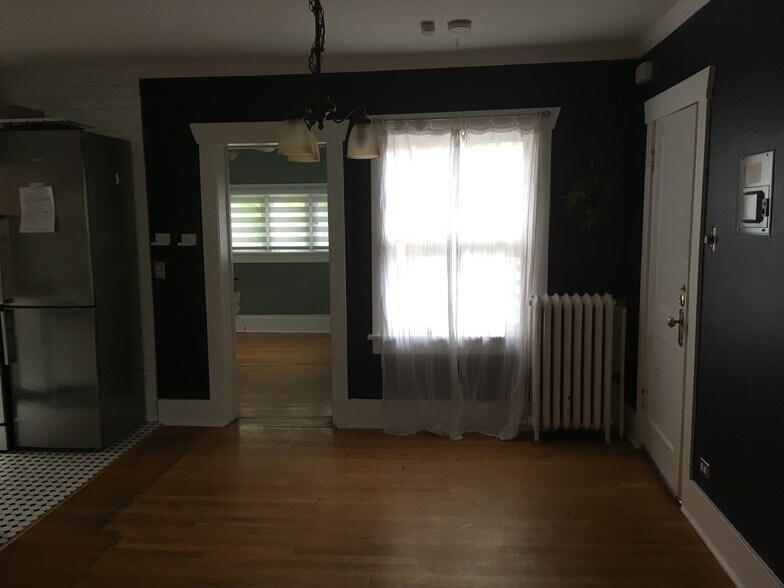 Dining area looking towards bedroom and window onto deck. - 945 Washington St