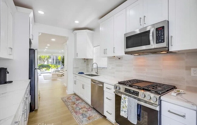 Building Photo - "Chic 1-Bedroom Retreat with Movie Room & ...
