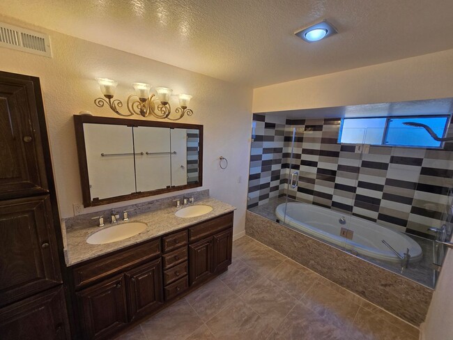Building Photo - Tri Level Townhouse located in a Gated Com...