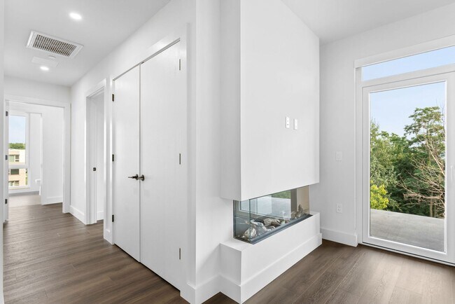 Building Photo - 2 Bedroom Corner-Unit with Wooded Balcony ...