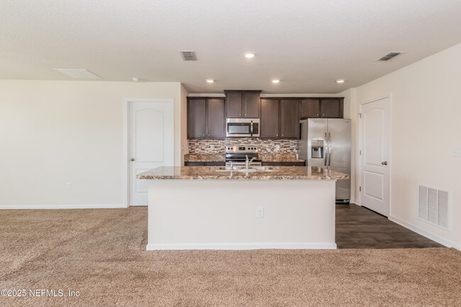 Building Photo - 15697 Saddled Charger Dr