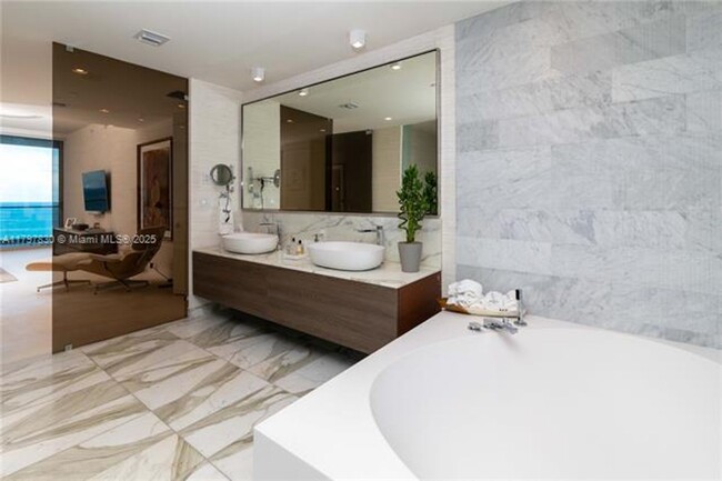 Building Photo - 10201 Collins Ave