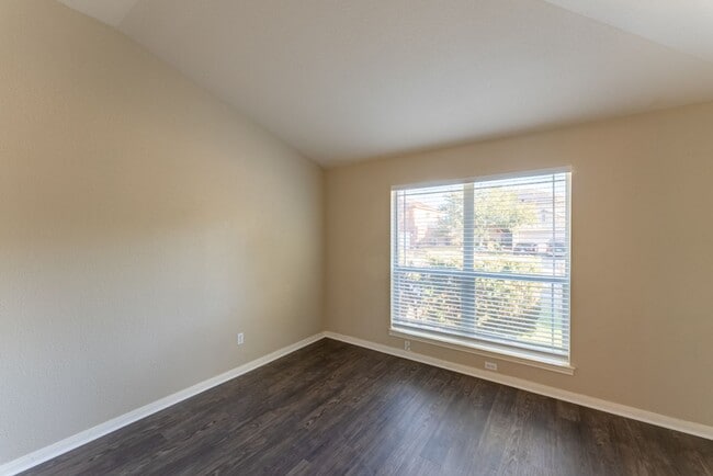 Building Photo - Charming Brick Home with Open Floorplan, Vaulted Ceilings, and Luxurious Amenities—Perfect for An...