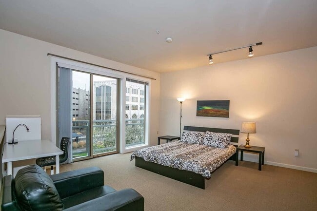 Building Photo - Gorgeous loft-style 2 floor condo with secured parking, A/C and rent includes most utilities!