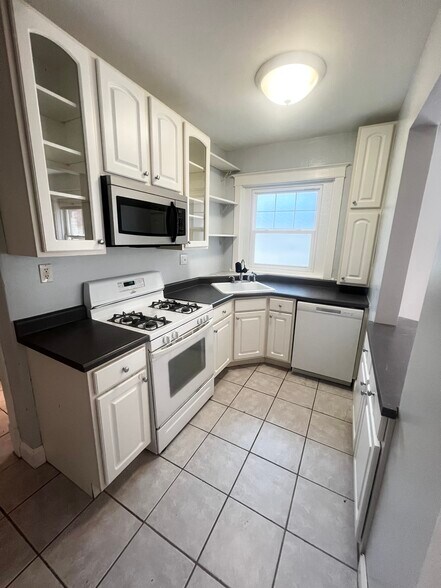 Pull out drawers beneath island. - 2107 Maury Ave