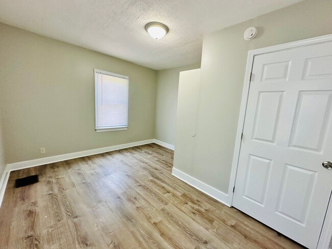 Building Photo - Updated two story home with unfinished bas...