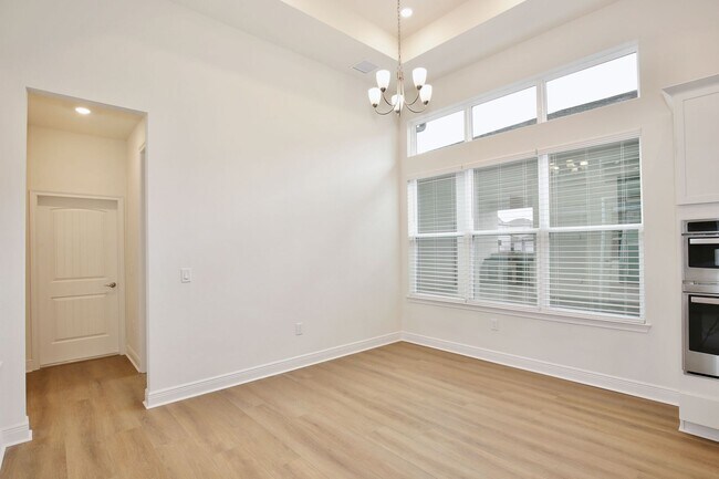 Building Photo - Gorgeous 4/3 Residence with a Private Back Lanai and a 2 Car Garage in the Delightful Laureate Pa...