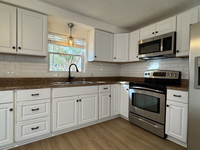 White subway tile backsplash - 2600 18th Ave S