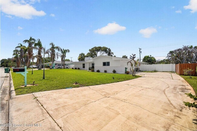 Building Photo - Welcome to this beautifully remodeled 4-bedroom, 3-bath home in the heart of Indialantic Beach!