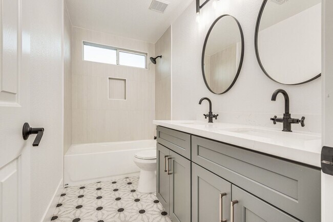 Building Photo - FULLY FURNISHED! Exudes sophistication wit...