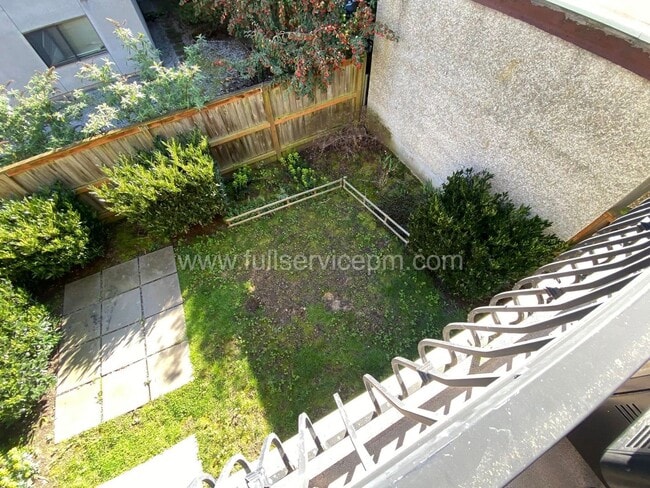 Building Photo - Spacious townhome with private backyard, garage parking, multiple decks, and a dedicated home off...