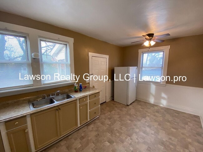 Building Photo - Updated Three Bedroom with Flat Yard