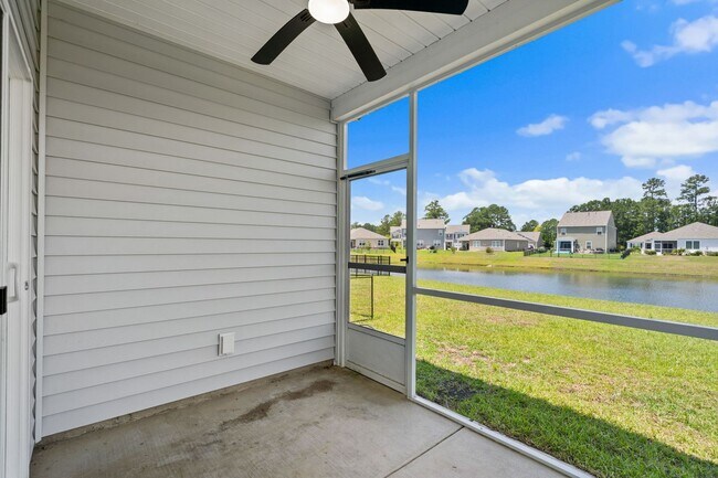 Building Photo - Modern 4BR Home with Screened Porch & Pond Views | Sun Colony, Longs SC