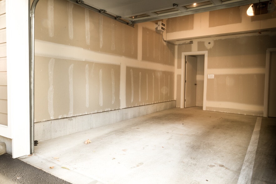 Single car garage with secure storage space. - 115 Hall Brothers Loop