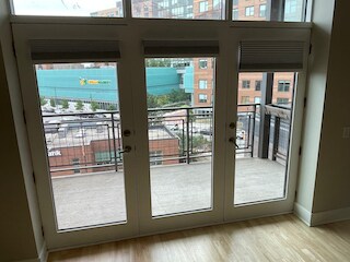 Large glass doors open to the porch. - 725 N Aberdeen St
