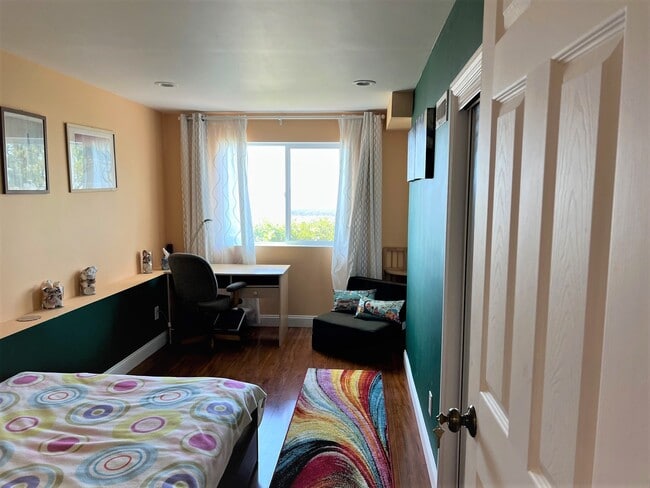 Bedroom 1 - full size bed, upholstered convertible chair-bed, desk, desk chair, large closet - 1627 15th Ave