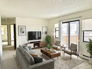 Building Photo - Spacious 2-Bedroom Apartment with Massive Private Deck, Covered Parking & Utilities Included!