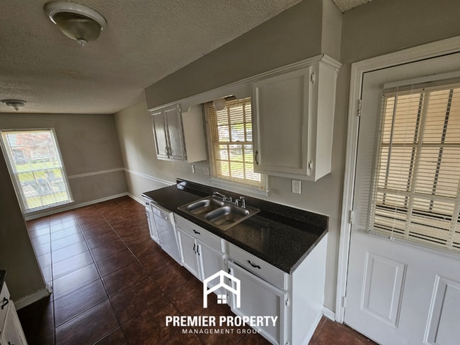 Building Photo - Quiet Cove Living in 38115 | 3BR/2BA with Brick Fireplace & Fenced Yard