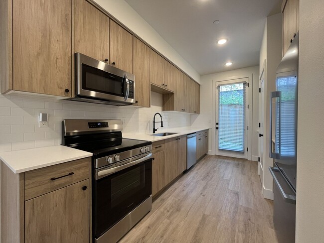 Building Photo - Modern 2-Bed, 1.5-Bath Condo with Custom Kitchen, Private Patio, and Prime Location