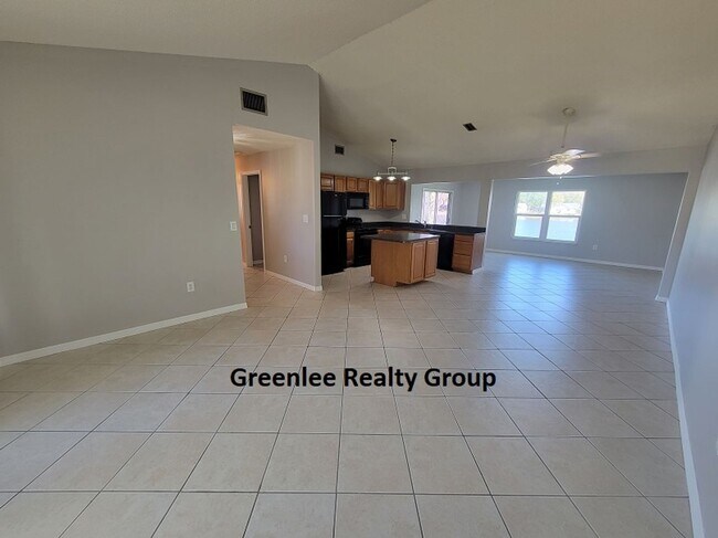 Building Photo - Relax by the water in this spacious 2-bedroom home with a 2-car garage, nestled in the highly des...