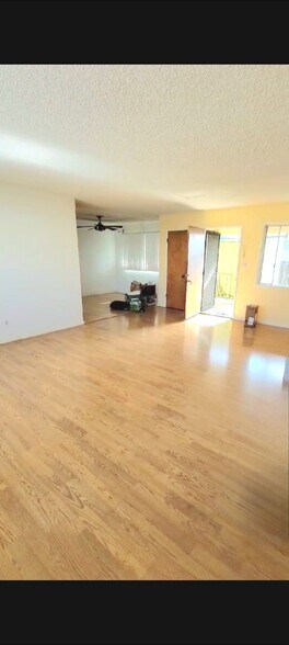 Liv room looking toward balcony and front door - 2239 N Frederic St