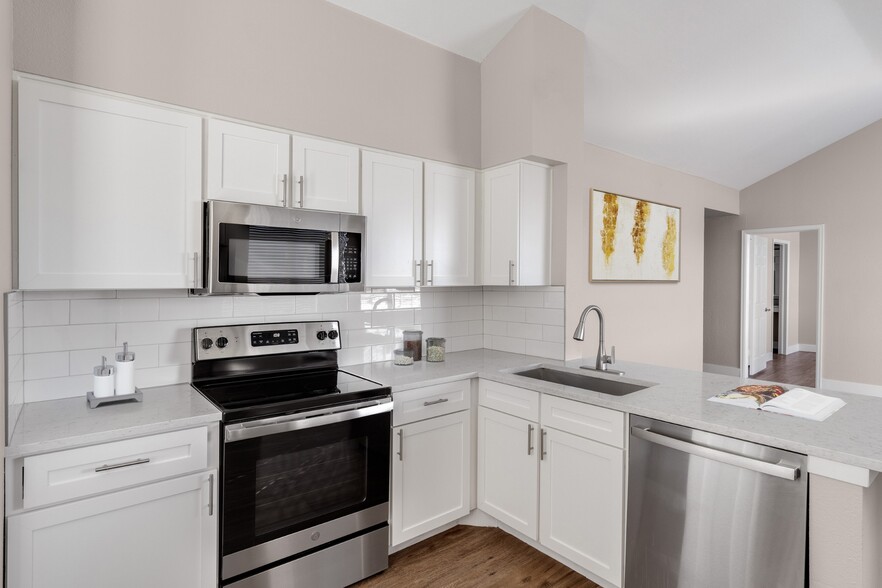 Kitchen with stainless-steel appliances at The Links at Plum Creek in Castle Rock, CO - The Links at Plum Creek