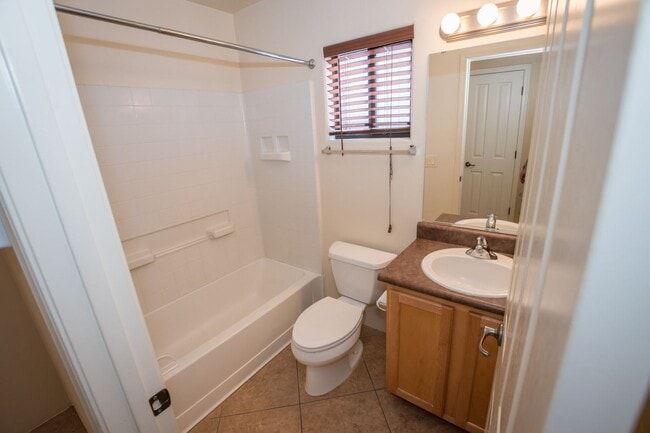 Building Photo - Gorgeous 3 Bedroom 2 Bathroom Home with Tile Throughout! Central A/C, 2 Car Garage!