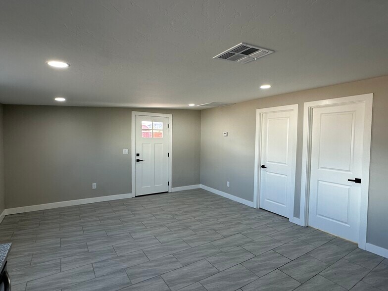 Living area with 2nd and 3rd bedrooms to the right - 1331 W Speedway Blvd
