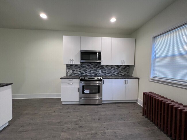 Building Photo - Updated 3 BR 2.5 bath house now available!