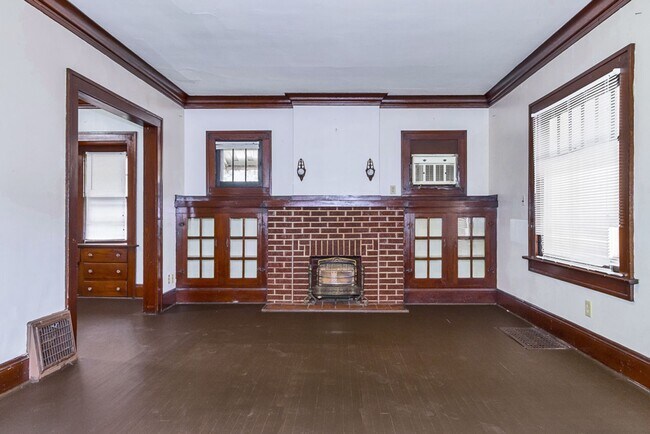 Building Photo - Charming 3BR Home with Classic Woodwork, Porch & Bonus Attic Space