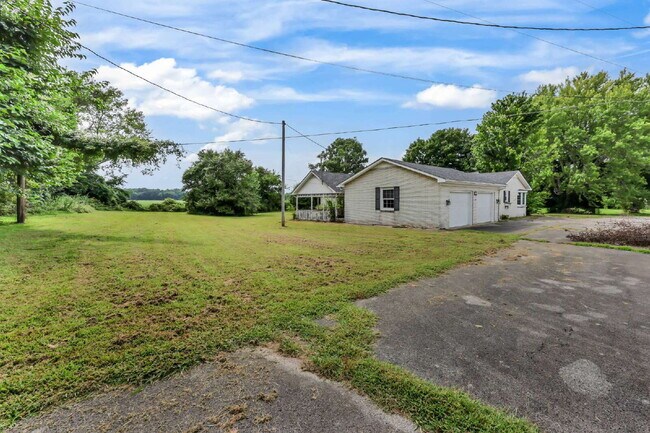 Building Photo - spacious 4-bedroom, 2.5-bath home featuring a 2-car garage and fresh updates throughout.