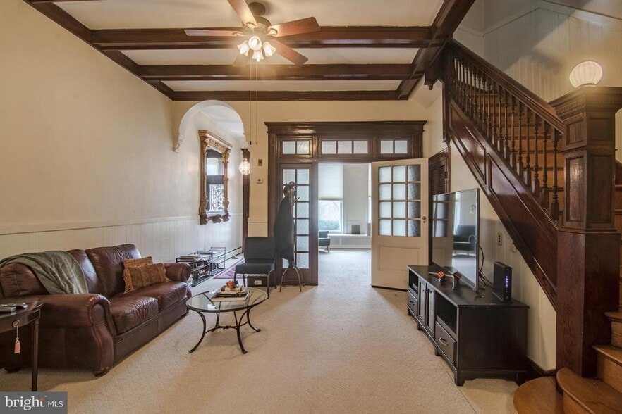 FRONT WELCOME SPACE AND STAIRCASE, VIEW TO LIVING ROOM - 2937 N Charles St