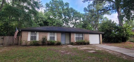 Building Photo - CHARMING SE 3/1.5 w/ Garage, Washer/Dryer, Large Privacy Fenced Yard, & Tile Floors Throughout! A...