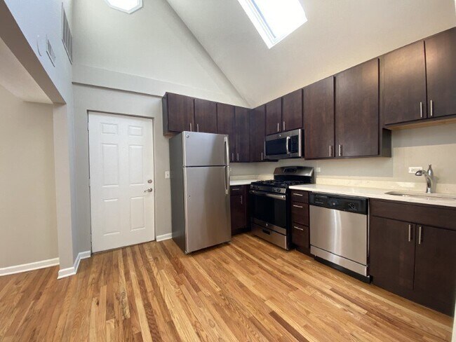 Large kitchen with hardwood floors - 1835 N Paulina