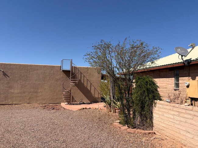 Building Photo - Desert Home on 3.3 Acres with Rooftop Views & Unique Rammed Earth Design