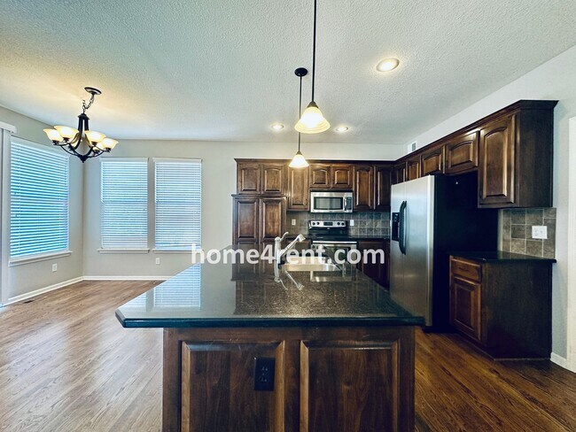 Building Photo - Gorgeous Olathe, 5 BR Home w/ Wood floors,...
