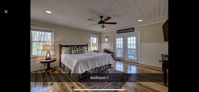 Master bedroom with doors to screened dining porch - 78 Citadel Ln