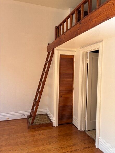 Ladder to loft, storage closet, and door to bathroom - 1516 Third St