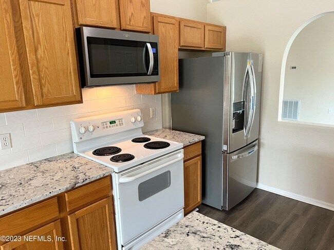 Building Photo - 6580 Gentle Oaks Dr N