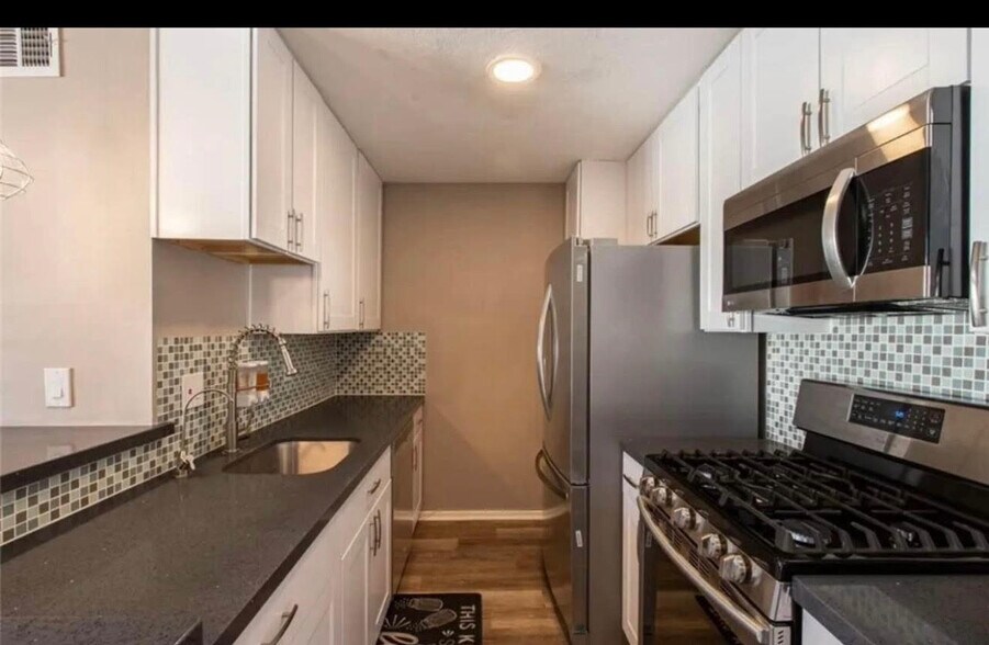 Appliance included refrigerator, dish washer, microwave, oven - 5700 Etiwanda Ave