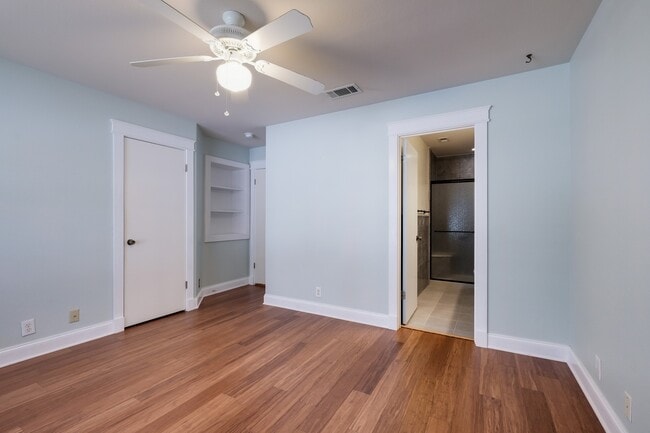 Building Photo - Modern Elegance: 3-Bedroom Townhome with Wood Flooring, Shaded Deck, and Inclusive Amenities