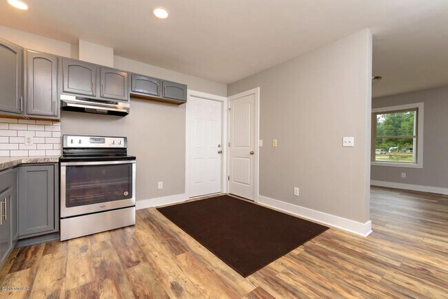 Building Photo - Spacious 3BR Duplex with Finished Basement & 2-Car Garage in Otsego