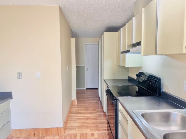Building Photo - Charming 3BR/1BA w/ 1-car garage, long driveway, fenced yard, wood stove & shed/workshop.