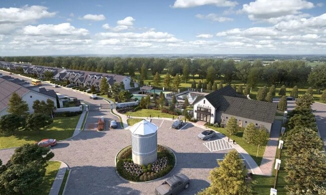 Modern townhomes with attached garages, and manicured landscaping - Camellia Grove Townhomes